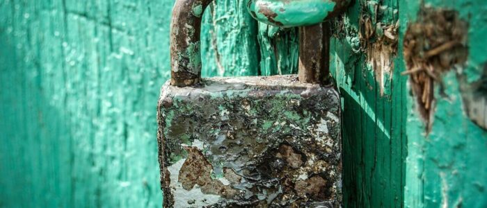 Rusty Padlock On Blue Door ALT